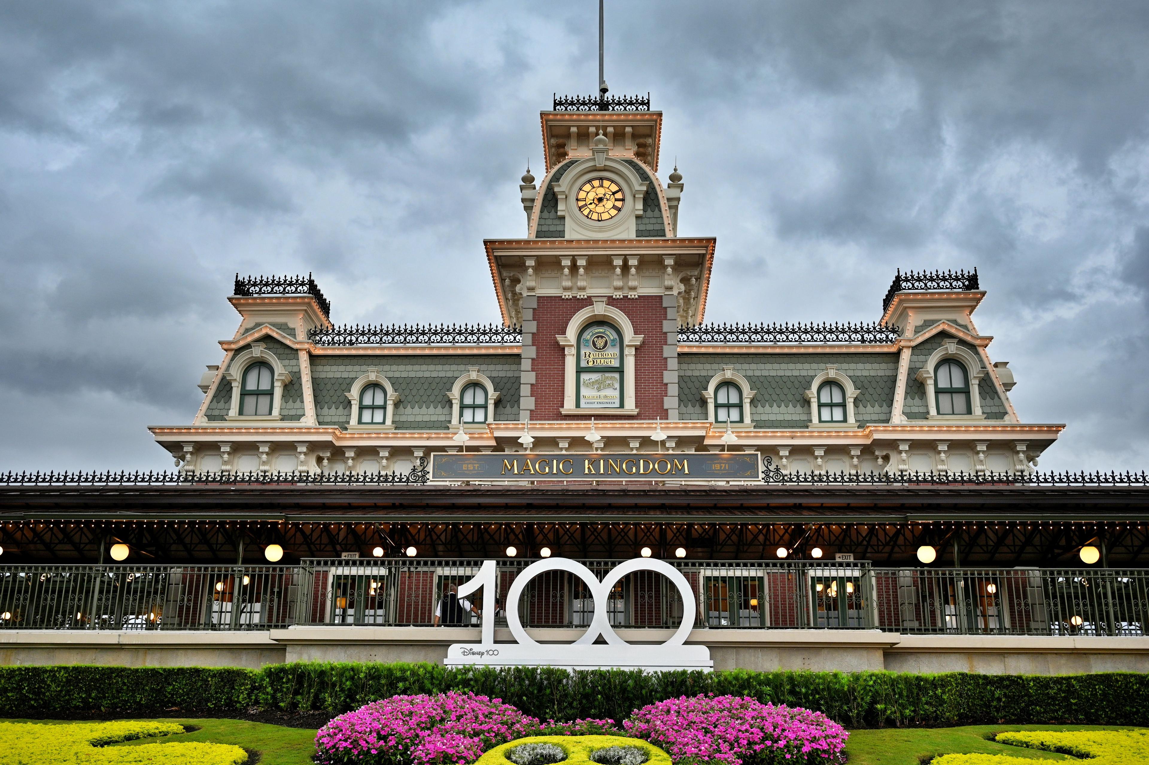 Magic Kingdom railway station beneath a cloudy sky